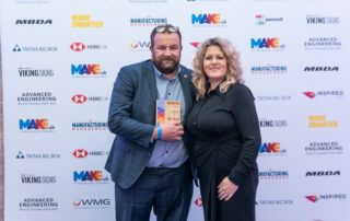 Luke Vardy accepting winners trophy from Dawn Huntrod of Make UK